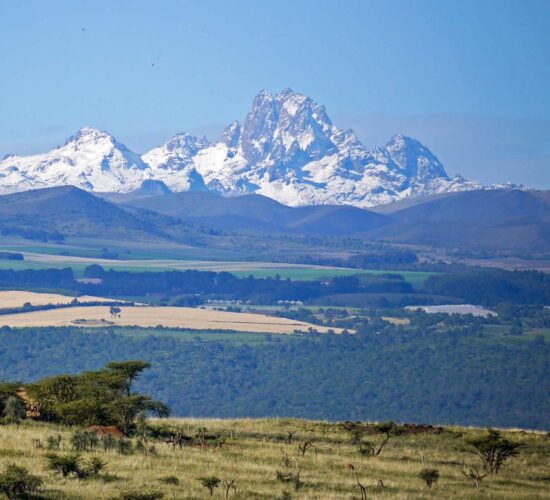 Snow-capped peaks of Mount Kenya under a clear blue sky